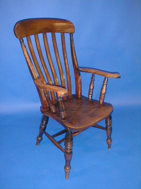 Appraisal: A Victorian beech and elm lath back grandfather chair