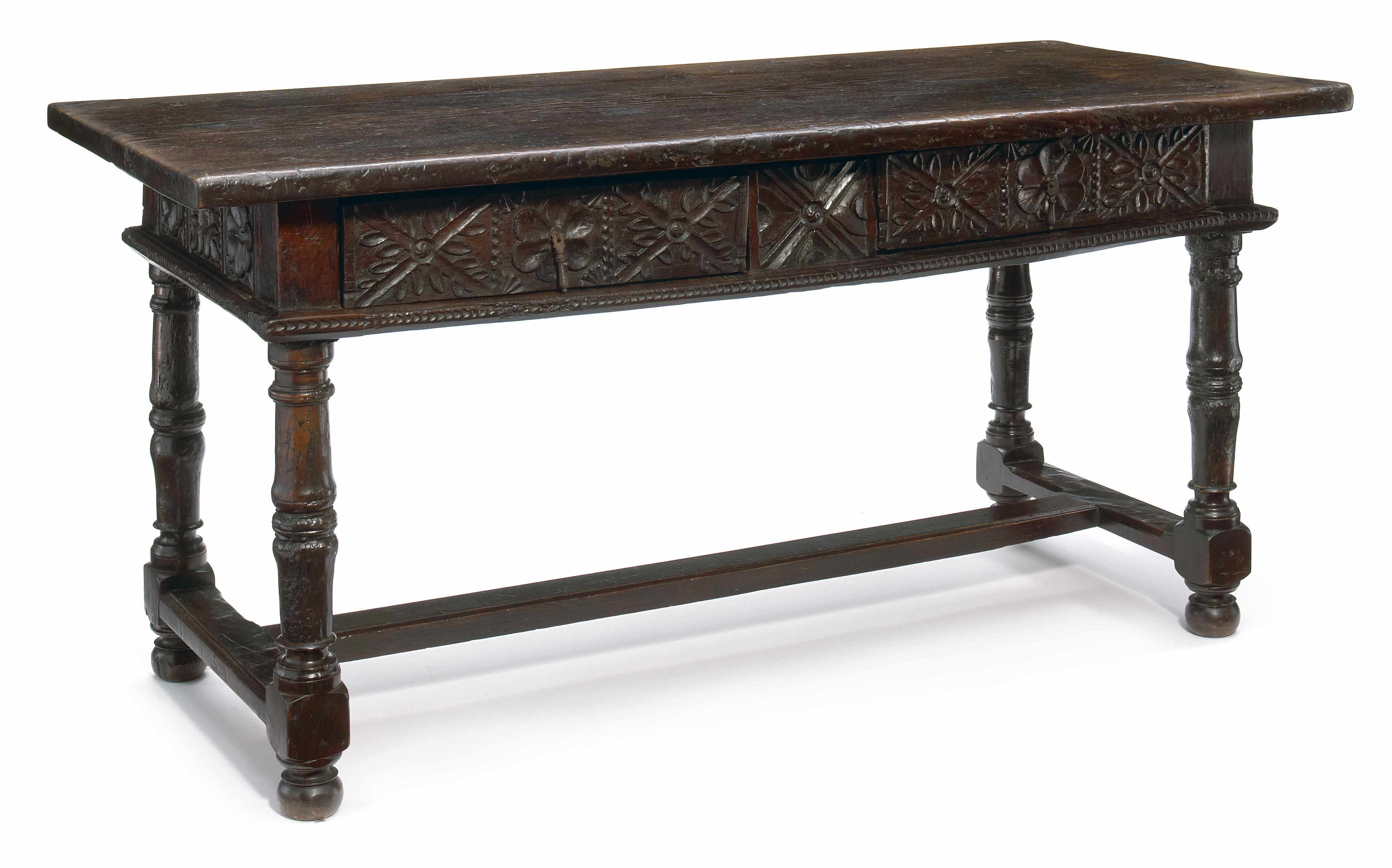 Appraisal: A Spanish Baroque chestnut and walnut library table incorporating antique