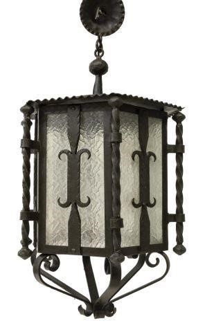 Appraisal: Spanish iron hanging lantern the single light concealed within a