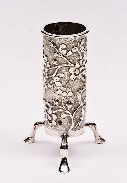 Appraisal: A CHINESE SILVER VASE of cylindrical form on three shaped