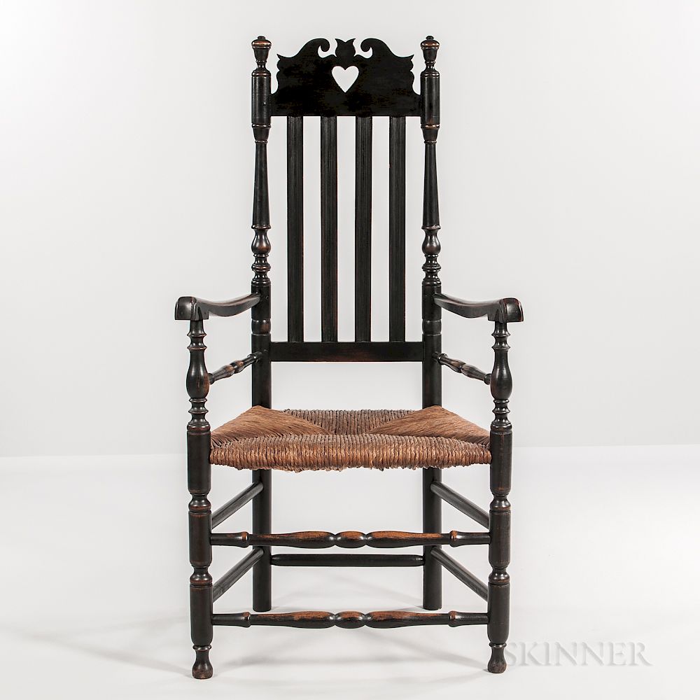 Appraisal: Black-painted Bannister-back Heart and Crown Armchair Black-painted Bannister-back Heart and