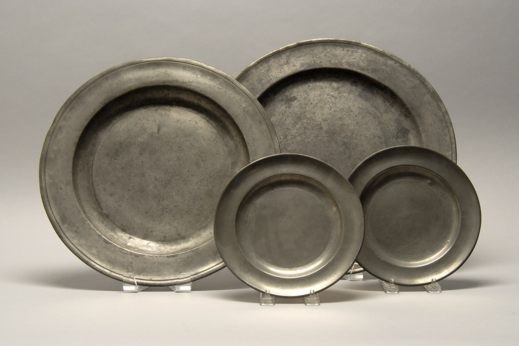 Appraisal: FOUR PIECES OF ENGLISH PEWTER Early th CenturyTwo chargers and