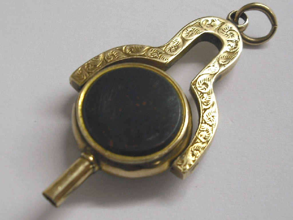 Appraisal: Victorian gold swivel pocket watch key set with a bloodstone