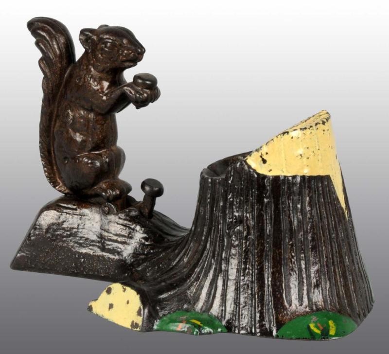 Appraisal: Cast Iron Squirrel Tree Stump Mechanical Bank Description Manufactured by