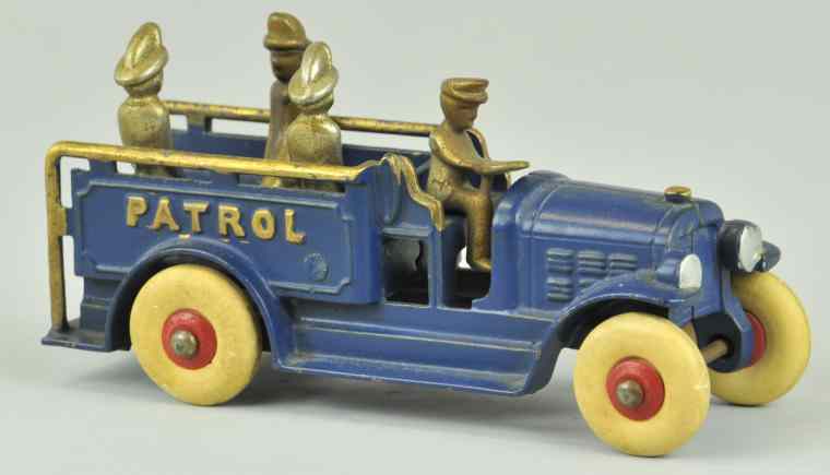 Appraisal: KENTON PATROL TRUCK WITH REMOVABLE DRIVER Cast iron painted in