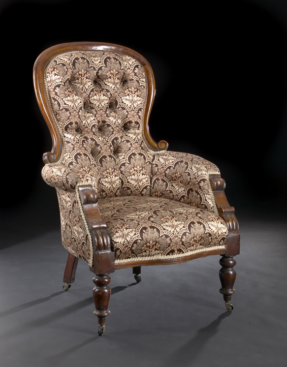 Appraisal: Victorian Walnut Armchair late th century the domed crest above