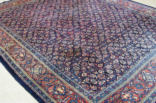 Appraisal: HAND KNOTTED PERSIAN CARPET overall Herati floral motif on dark