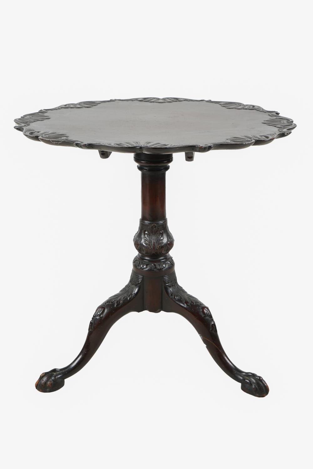 Appraisal: GEORGIAN STYLE MAHOGANY TILT-TOP TABLEcircular top with rocaille-carved edge on