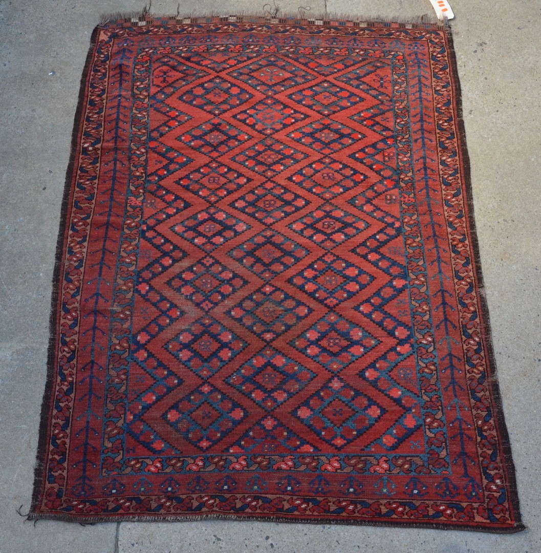 Appraisal: x Turkish carpet red field with diamond medallions some losses