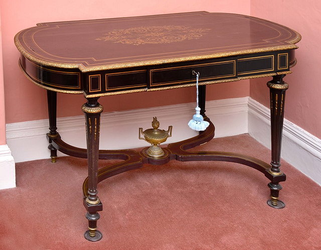 Appraisal: A FRENCH TH CENTURY OVAL EBONISED CENTRE TABLE with gilt