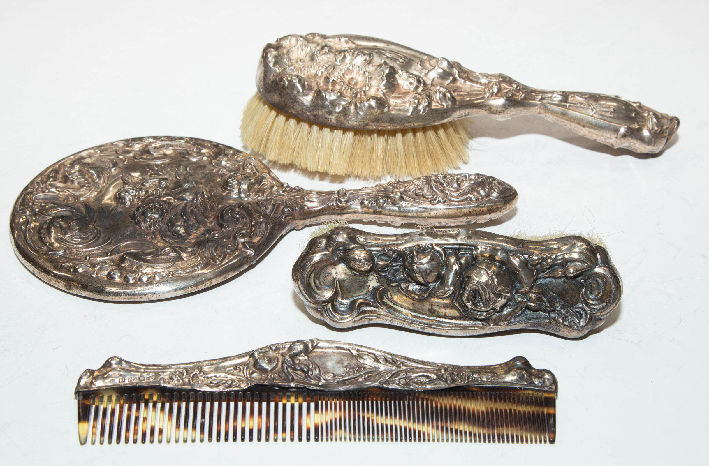 Appraisal: ASSEMBLED ART NOUVEAU STERLING DRESSER SET Includes hand-mirror clothes brush