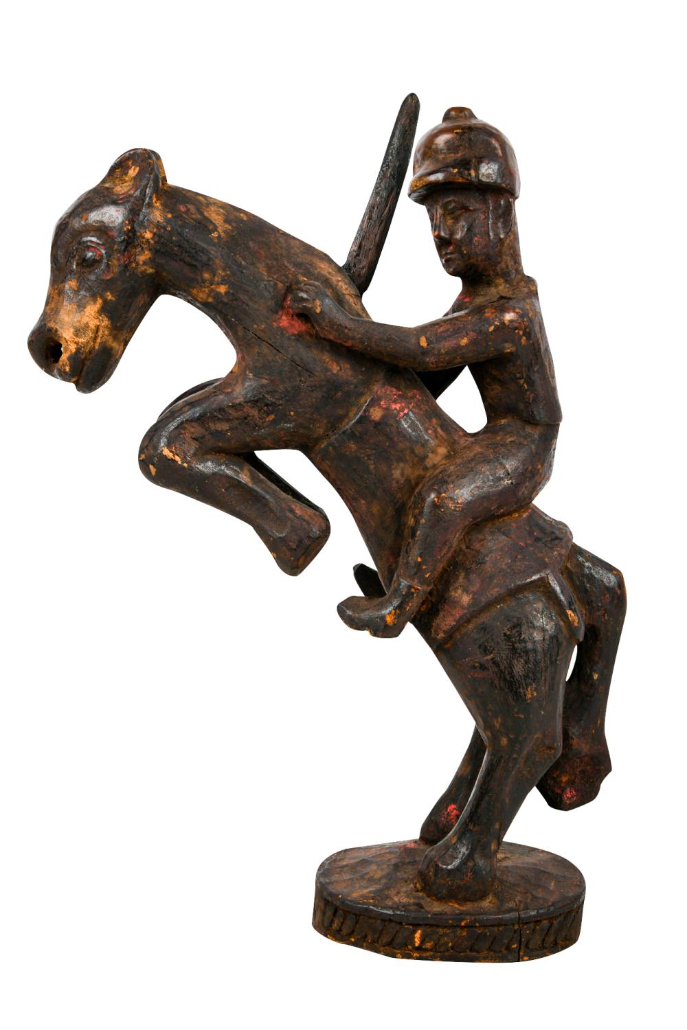 Appraisal: NEPALESE CARVED WOOD FIGURE ON HORSE BACKwith detachable sword Condition