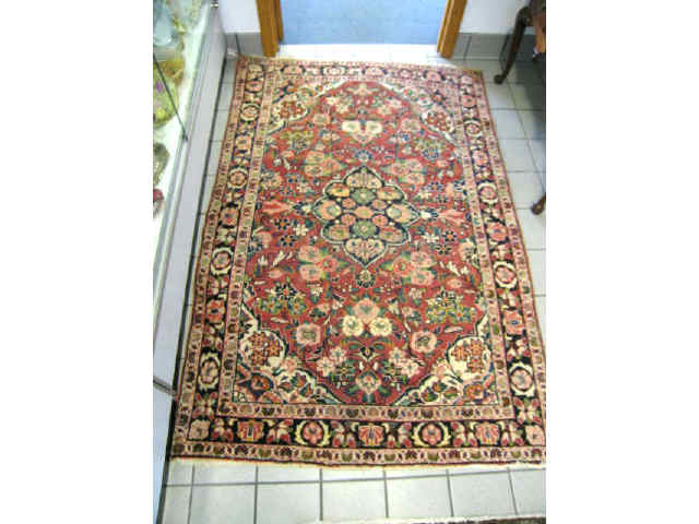 Appraisal: Mahal Persian Handmade Rug rich floral on red field ivory