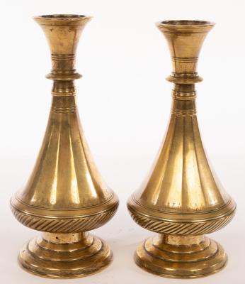 Appraisal: A pair of Mughal bronze tapering vases with circular stepped