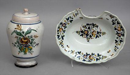 Appraisal: FRENCH FAIENCE POLYCHROME BARBER'S BOWL AND AN APOTHECARY JAR AND