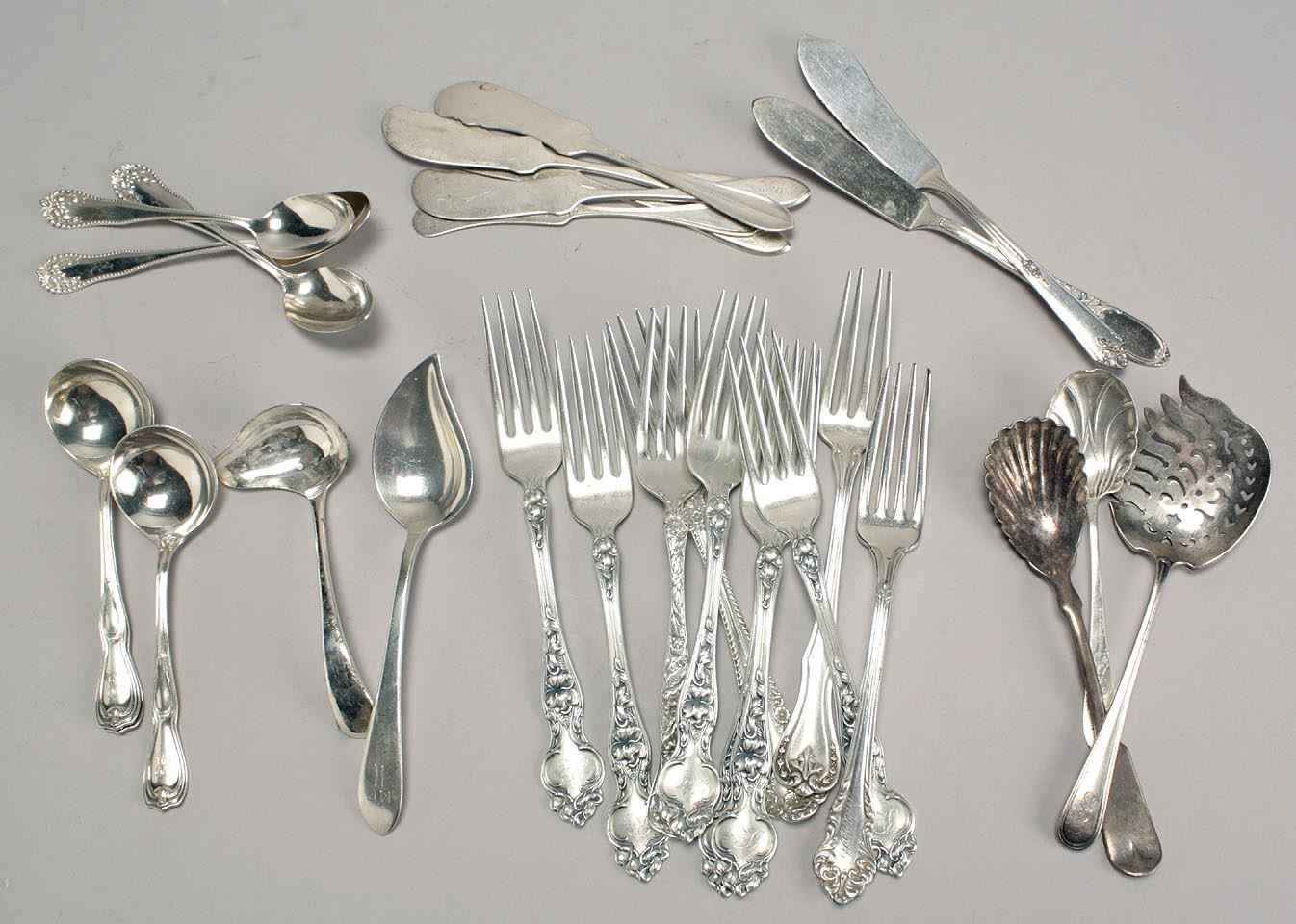 Appraisal: THIRTY-THREE PIECES OF STERLING SILVER AND SILVER PLATED FLATWAREBy various