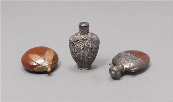 Appraisal: THREE SNUFF BOTTLES TWO STONES FRAMED WITH SILVER ONE IN