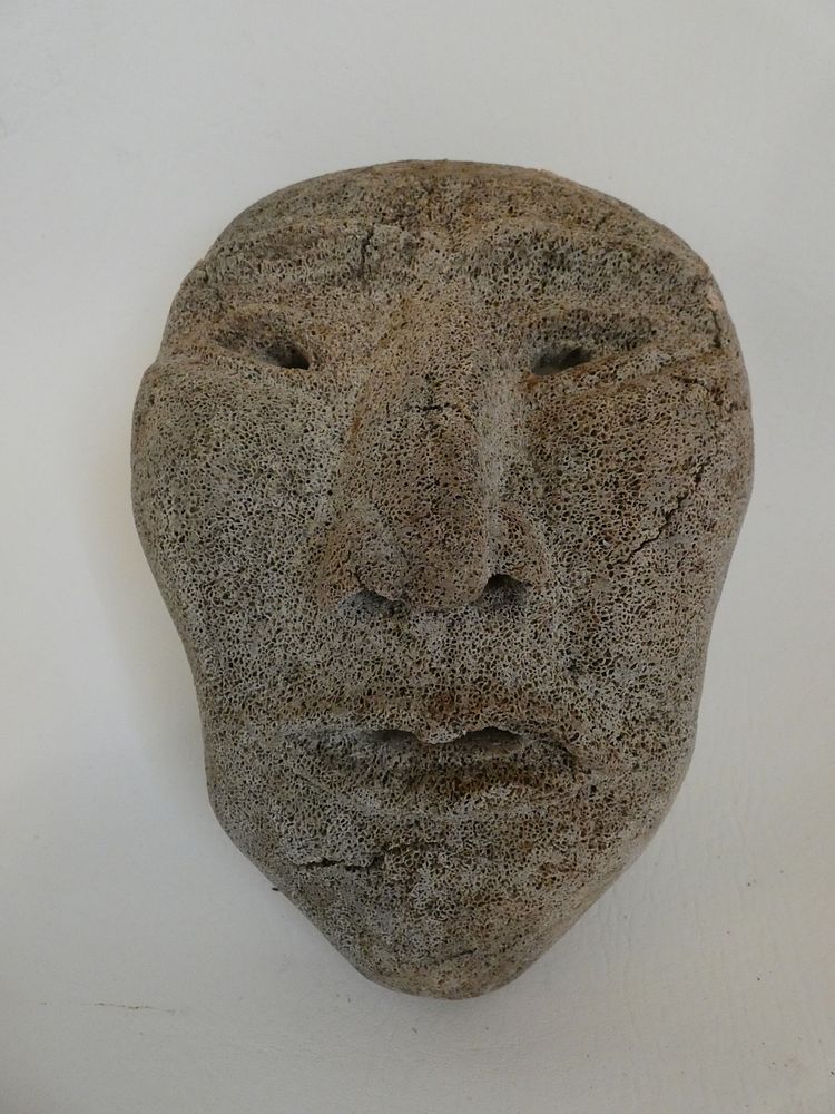 Appraisal: INUIT WHALE BONE MASK Inuit carved whale vertebrae mask x