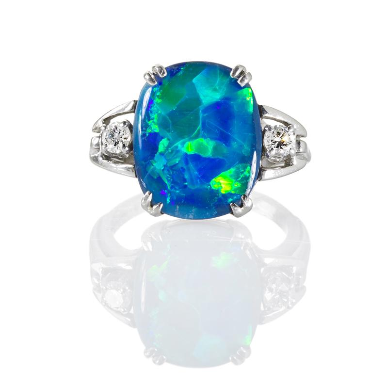 Appraisal: HARLEQUIN BLACK OPAL AND DIAMOND PLATINUM RING Blue-green color plays