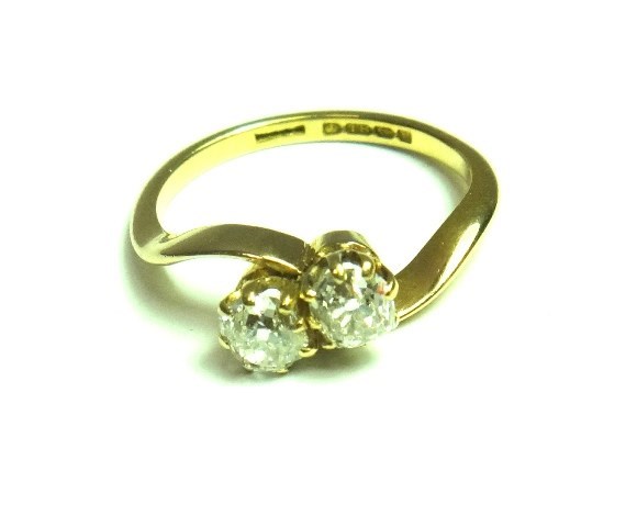 Appraisal: An ct gold ring claw set with two cushion shaped