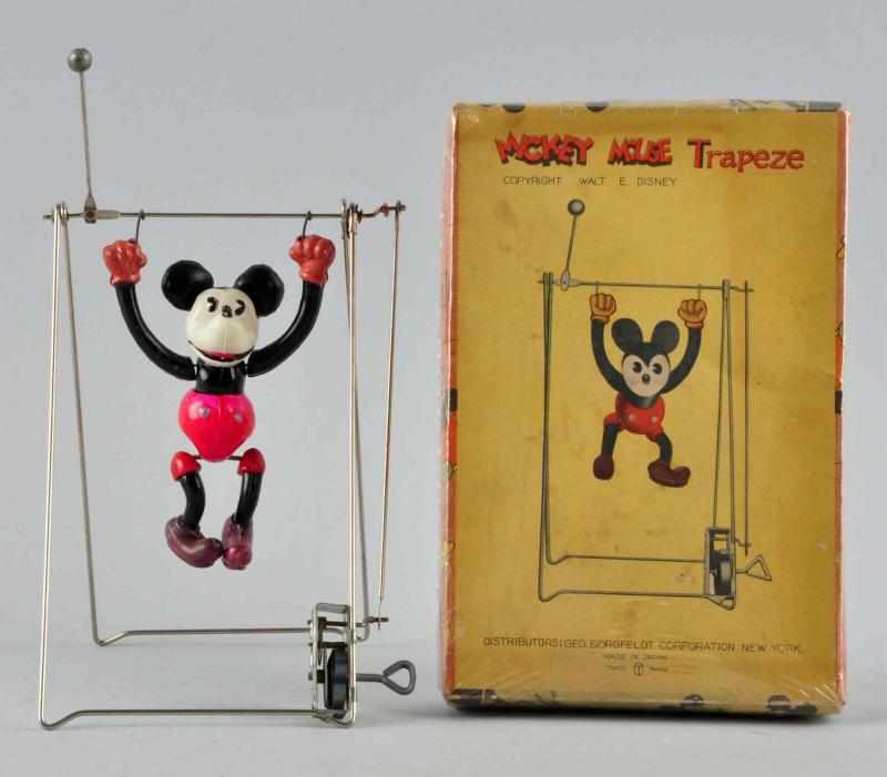 Appraisal: Celluloid Disney Mickey Mouse Trapeze Wind-Up Toy Description Japanese Circa