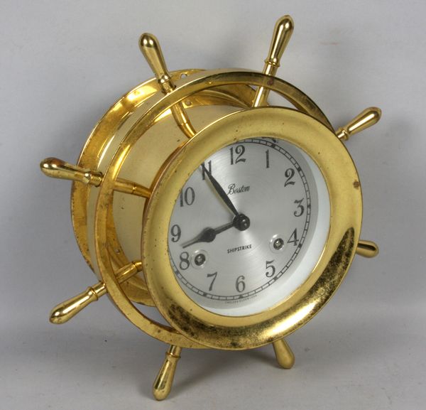 Appraisal: th Century Chelsea shipstrike clock in brass ships wheel housing