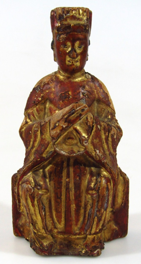 Appraisal: A thC Chinese carved giltwood and red lacquered figure possibly