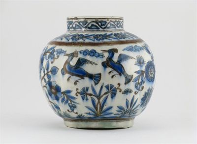 Appraisal: A Middle Eastern moulded ovoid vase painted with four birds