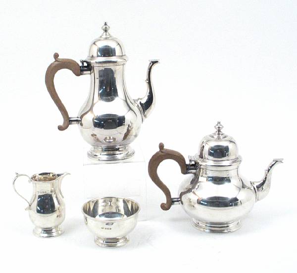 Appraisal: A silver and wood four piece tea and coffee set