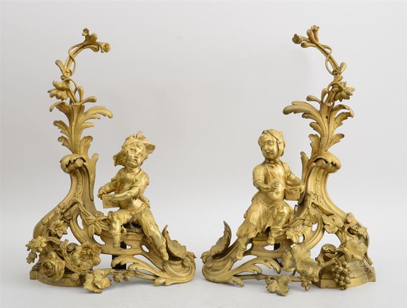 Appraisal: PAIR OF LOUIS XV STYLE GILT-METAL FIGURAL CHENETS Each modeled