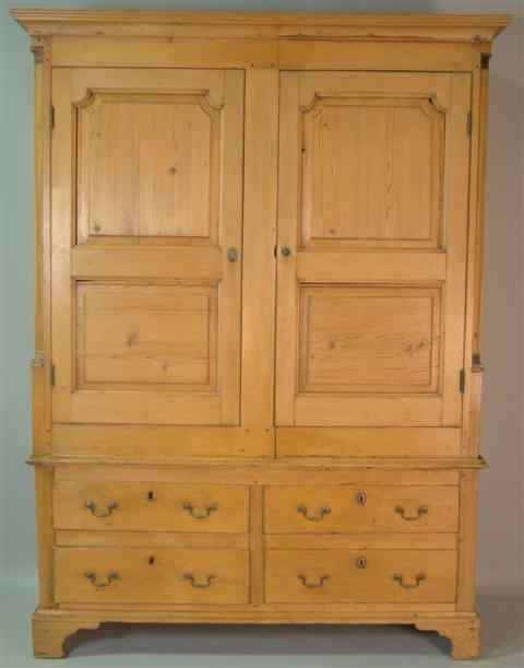 Appraisal: IRISH PINE ARMOIRE composed of late th century sections in