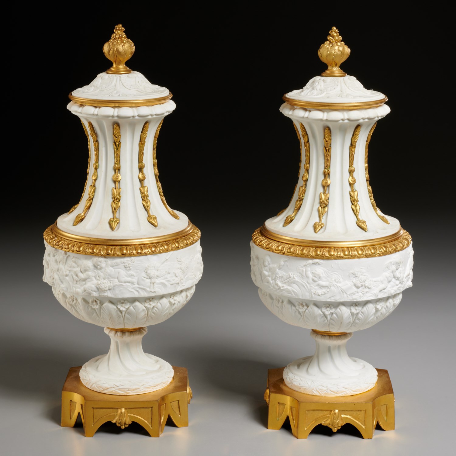 Appraisal: PAIR SEVRES ORMOLU MOUNTED BISQUE URNS Letter dated France unglazed