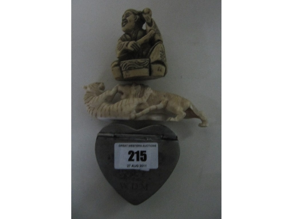 Appraisal: Lot comprising two carved figures and a heart shaped white