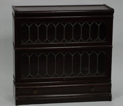 Appraisal: A leaded glass Globe Wernicke type two-part bookcase with drawers