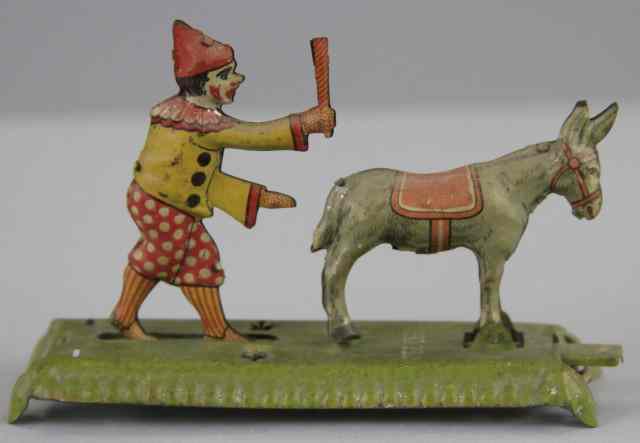 Appraisal: CLOWN AND DONKEY PENNY TOY Meier Germany lithographed tin depicts