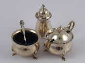 Appraisal: A three piece silver cruet on pad feet Birmingham with