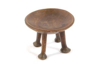 Appraisal: A th century African stool with a circular dish seat