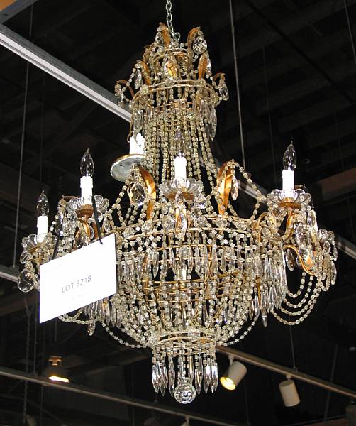 Appraisal: A Regency style gilt metal and glass eight light chandelier