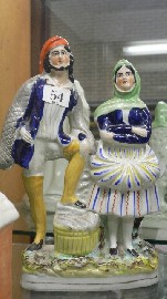 Appraisal: A Staffordshire figure of a fisherman and wife cmh