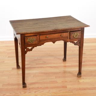 Appraisal: English Provincial oak dressing table English Provincial oak dressing table