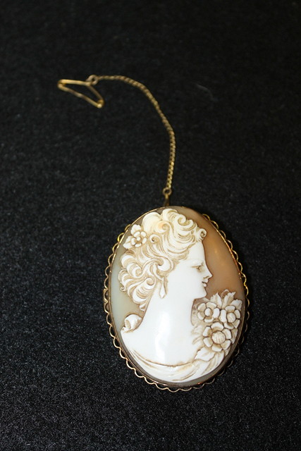 Appraisal: AN VICTORIAN OVAL CARVED CAMEO of a young woman's head