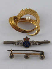 Appraisal: A mixed lot comprising two carat gold brooches gms and