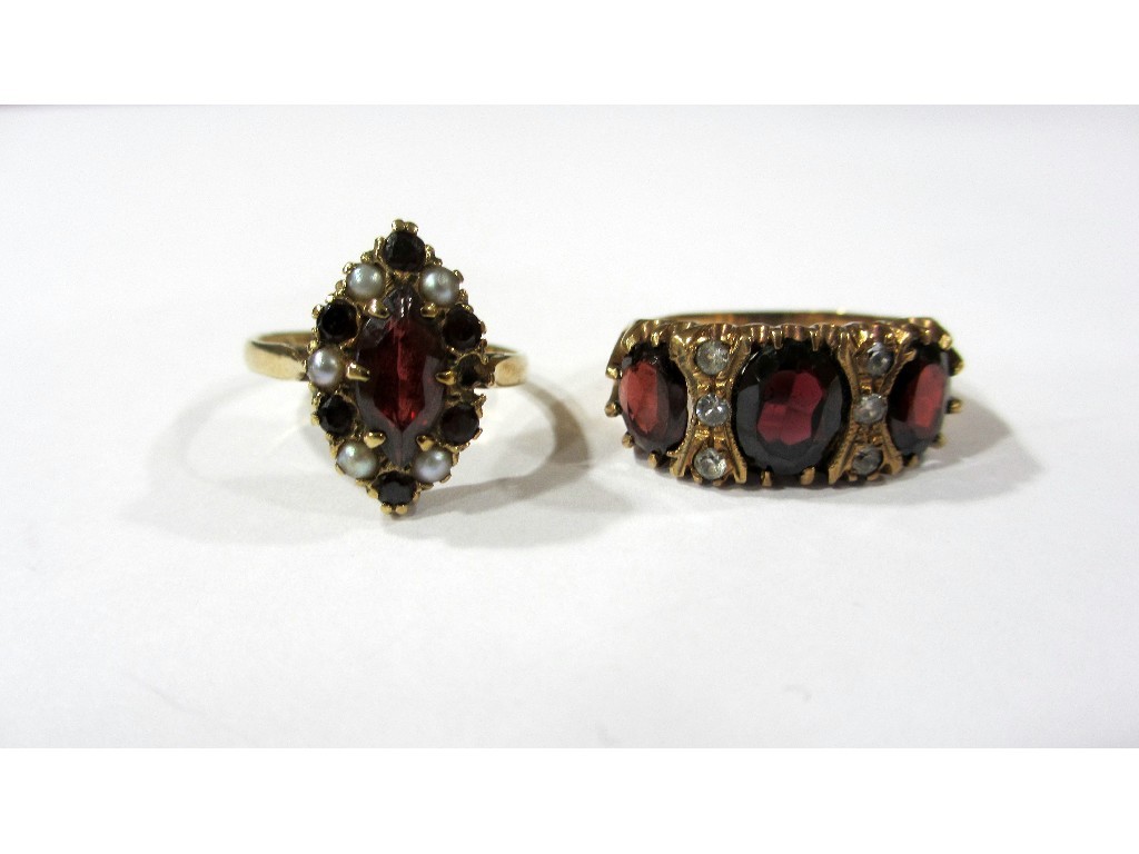 Appraisal: A marquise garnet and pearl dress ring and a large