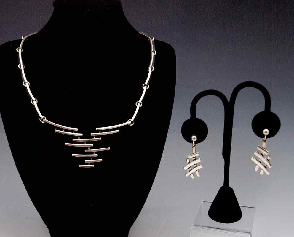 Appraisal: MEXICAN SILVER NECKLACE EARRINGS Unusual high style necklace in a