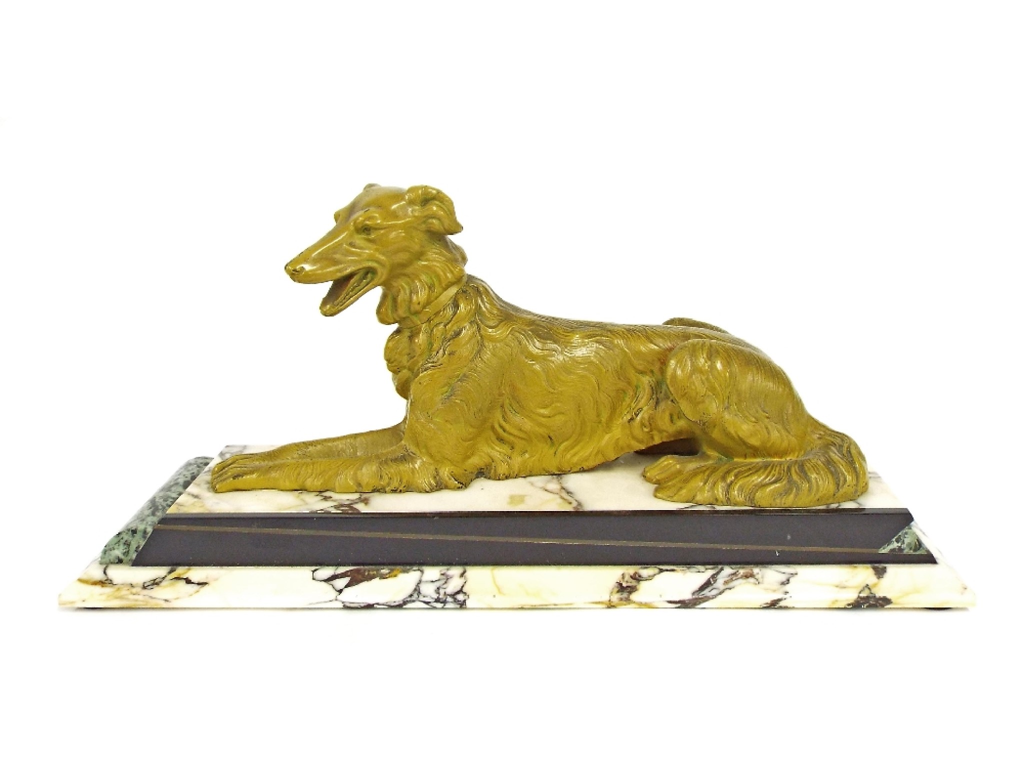 Appraisal: Art Deco cold painted cast bronze figure of a recumbent