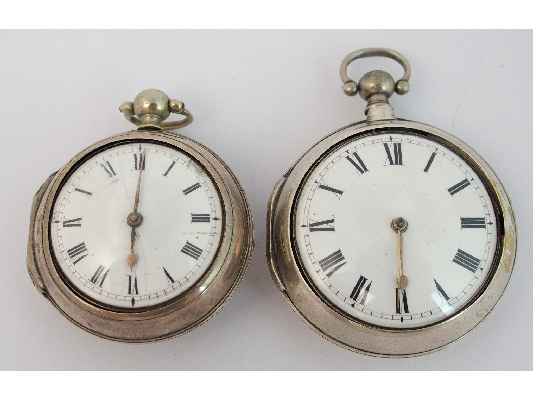 Appraisal: Two Georgian silver pair cased verge pocket watchesLondon matching cases