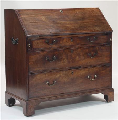 Appraisal: A George III mahogany bureau the fall-front enclosing a fitted