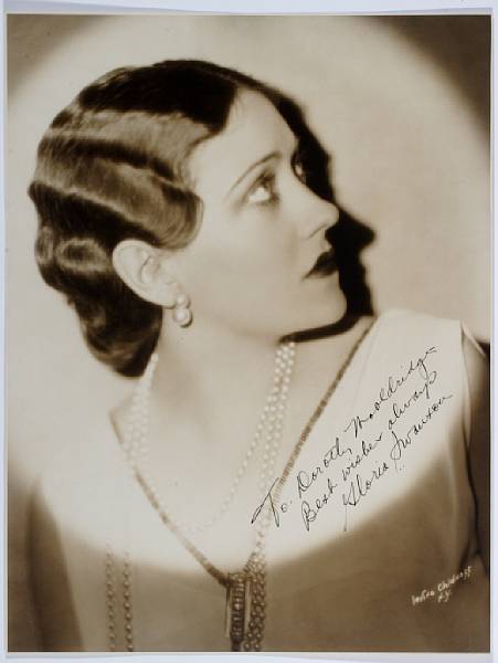 Appraisal: A Gloria Swanson signed sepia photograph s A vintage print