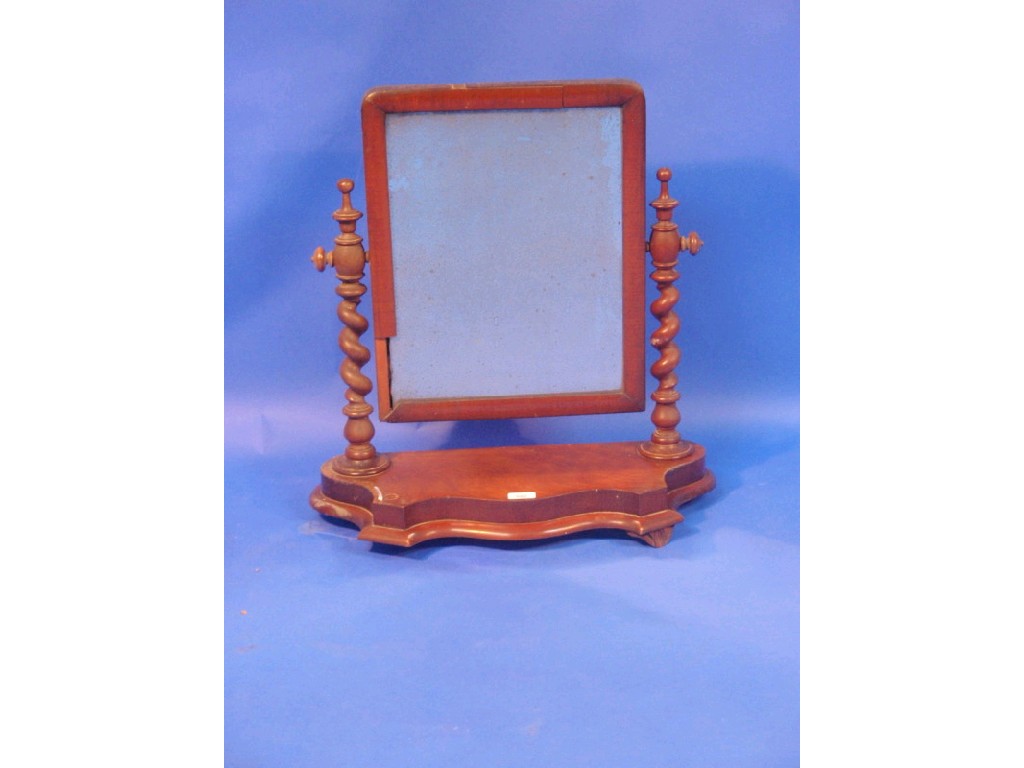 Appraisal: A Victorian flamed mahogany dressing table mirror with barley twist