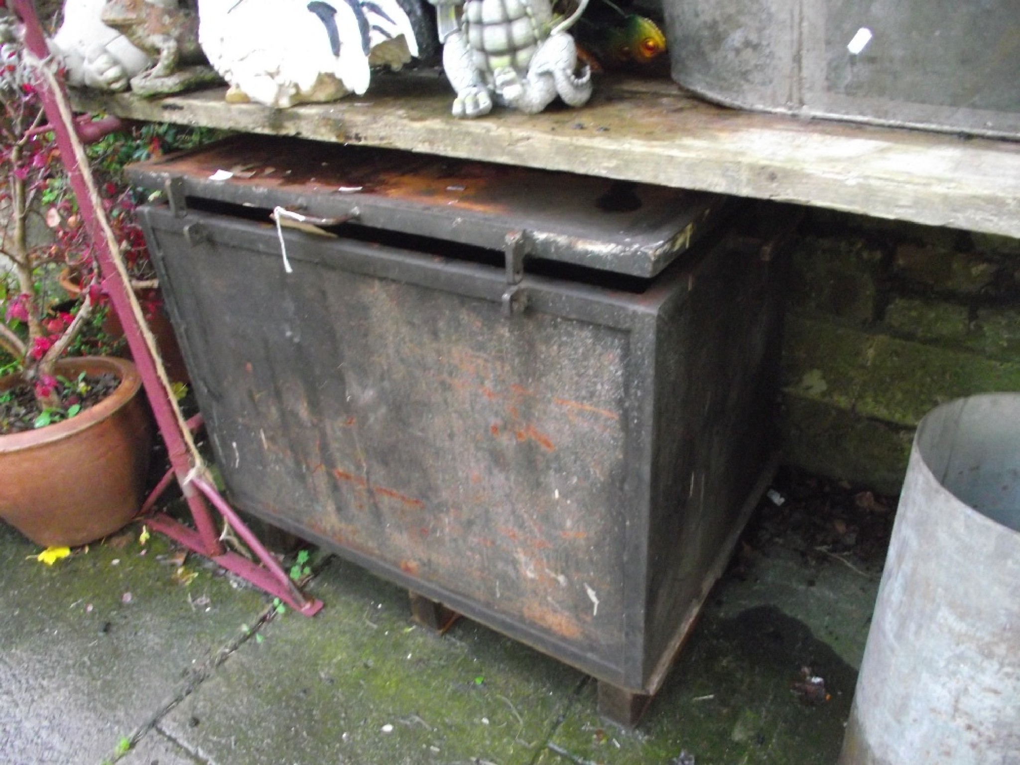 Appraisal: A low ironwork garden conservatory table of oval form raised